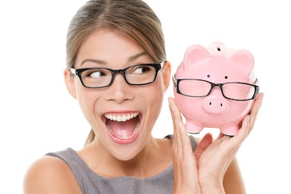 happy woman with glasses and piggybank