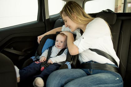 Mum and baby in backseat of car