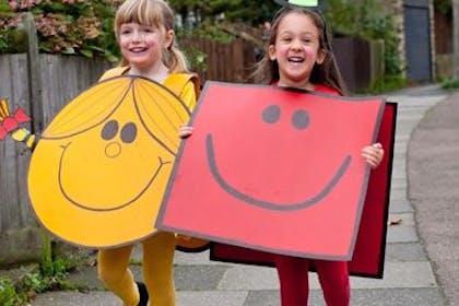 two girls dressed in little miss costumes
