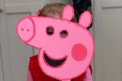 Young girl in a Peppa Pig World Book Day costume
