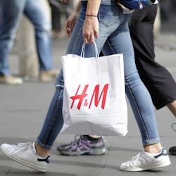 Woman with H&M shopping bag